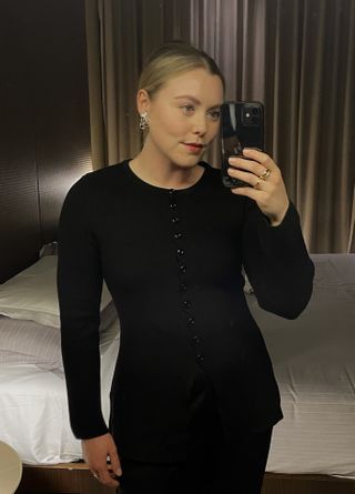 Woman wears black cardigan