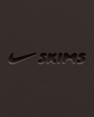 A brown logo of Nike and SKIMS.