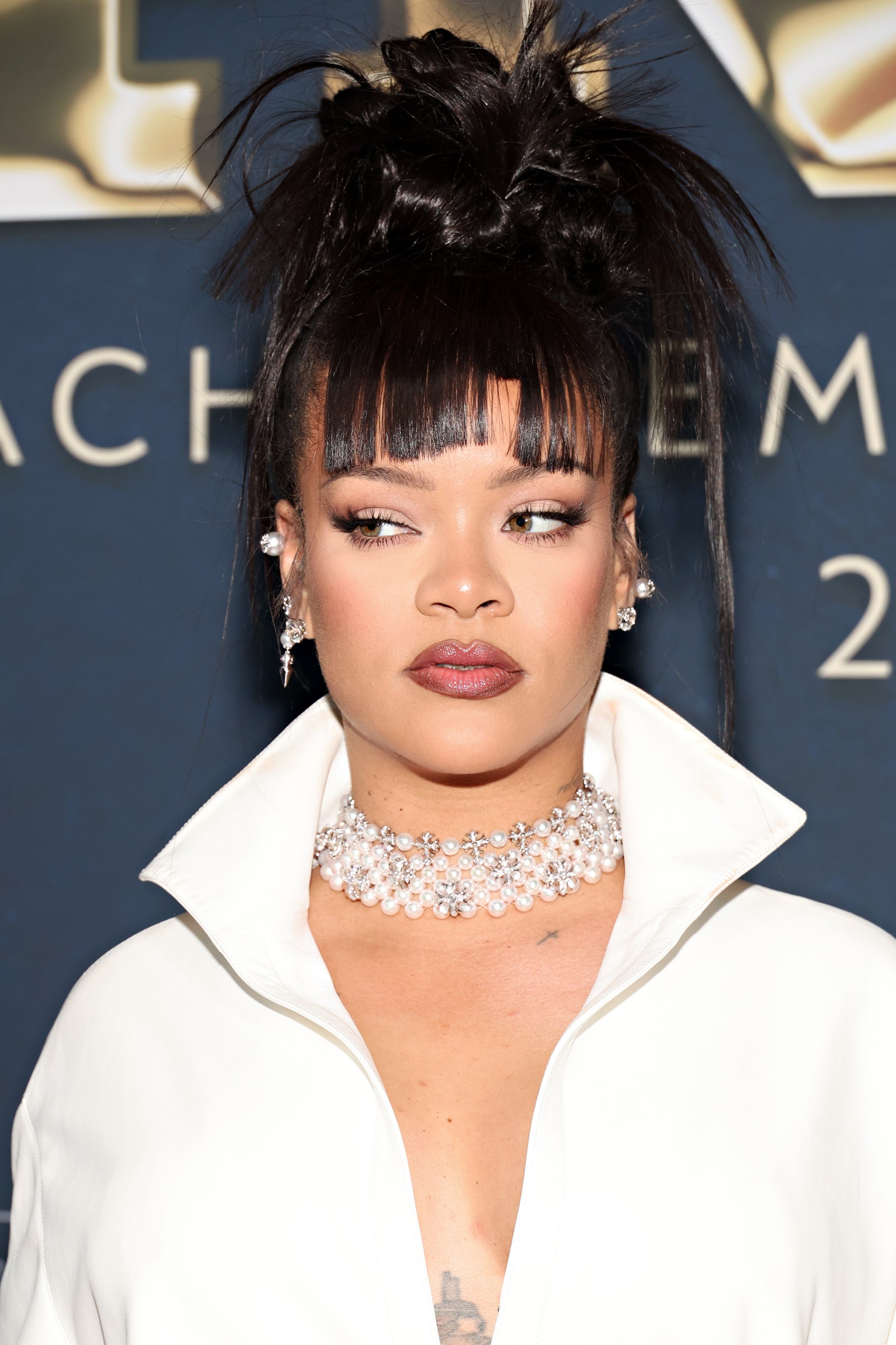 Image may contain Rihanna Black Hair Hair Person Accessories Jewelry Necklace Face and Head