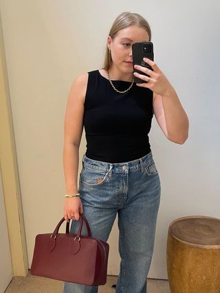 Woman wears Reformation Dusk Knit Top