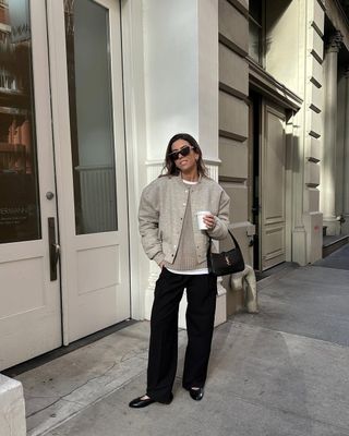 @hannahlewisstylist wears a wool bomber jacket