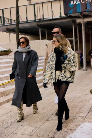 A street style image of a chic woman wearing an on-trend outfit on the streets of New York City during fashion week.