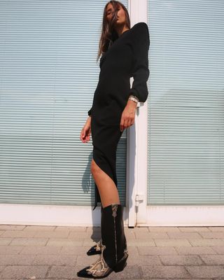 French woman wearing Western boots with black midi dress.