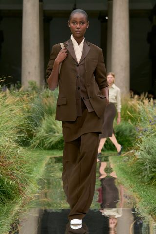 A model wears wears skirt trousers on the Boss spring/summer 2025 runway.