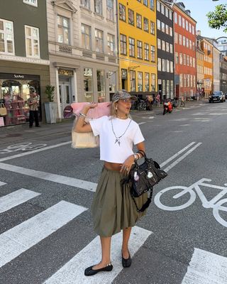 a fashion influencer carrying the Balenciaga City Bag