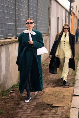 Milan Fashion Week attendees wear satin shoes.