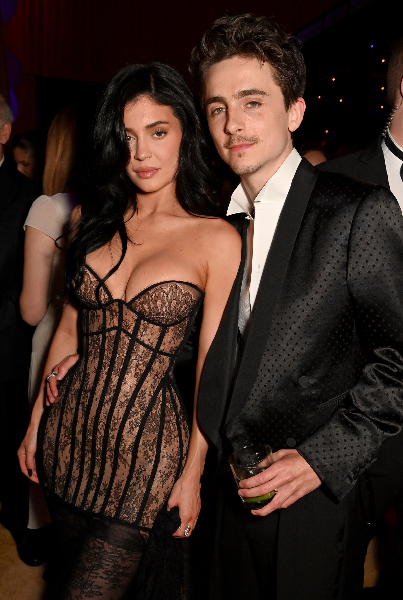 Image may contain Timothe Chalamet Kylie Jenner Cup Adult Person Fashion Clothing Formal Wear Suit and Accessories