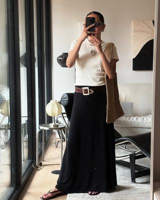 Dawn in white T-shirt and black maxi skirt