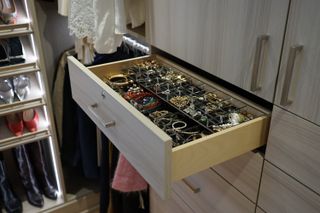 A photo of a jewelry organizer in a drawer.