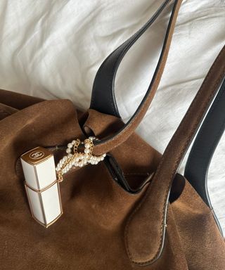 Chanel Coco Mademoiselle Purse Chain attached to a brown suede bag