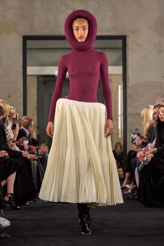 Alaia fall 2025 runway collection featuring sculptural forms.