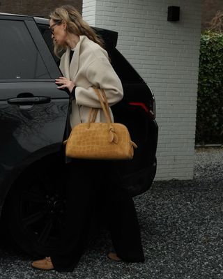 Anouk in suede loafers with a matching bag