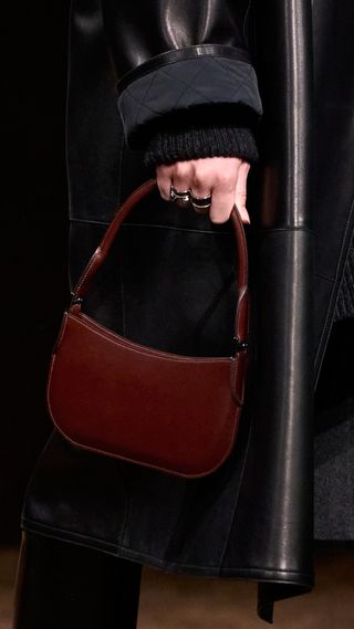 detail image of a red pochette bag on the Hermes runway fall/winter 2025