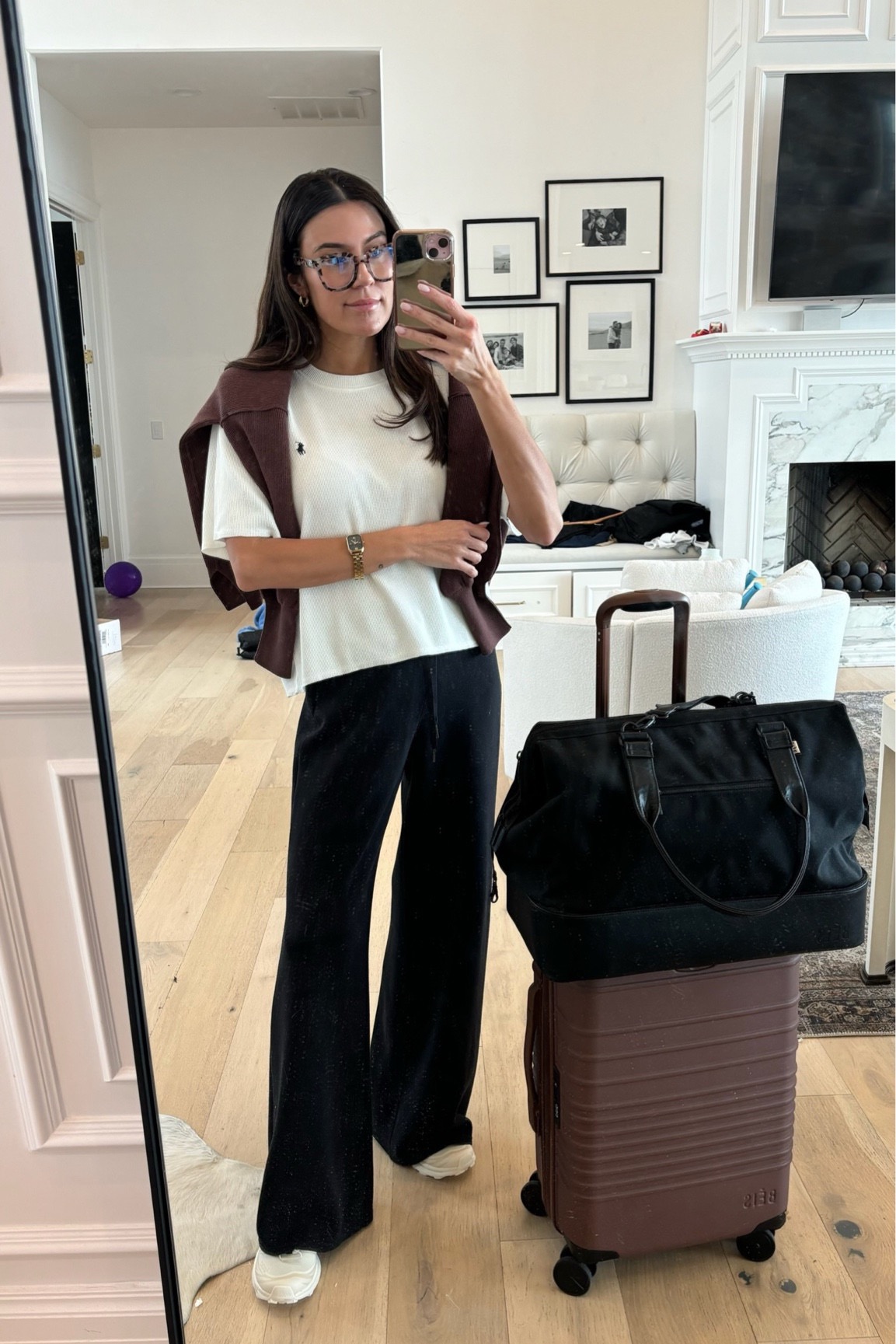 Christine Andrew airport travel outfit with beis luggage