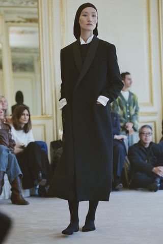 a model walks The Row winter 2025 runway during Paris Fashion Week