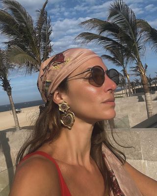 woman wearing silk headscarf and bikini on vacation