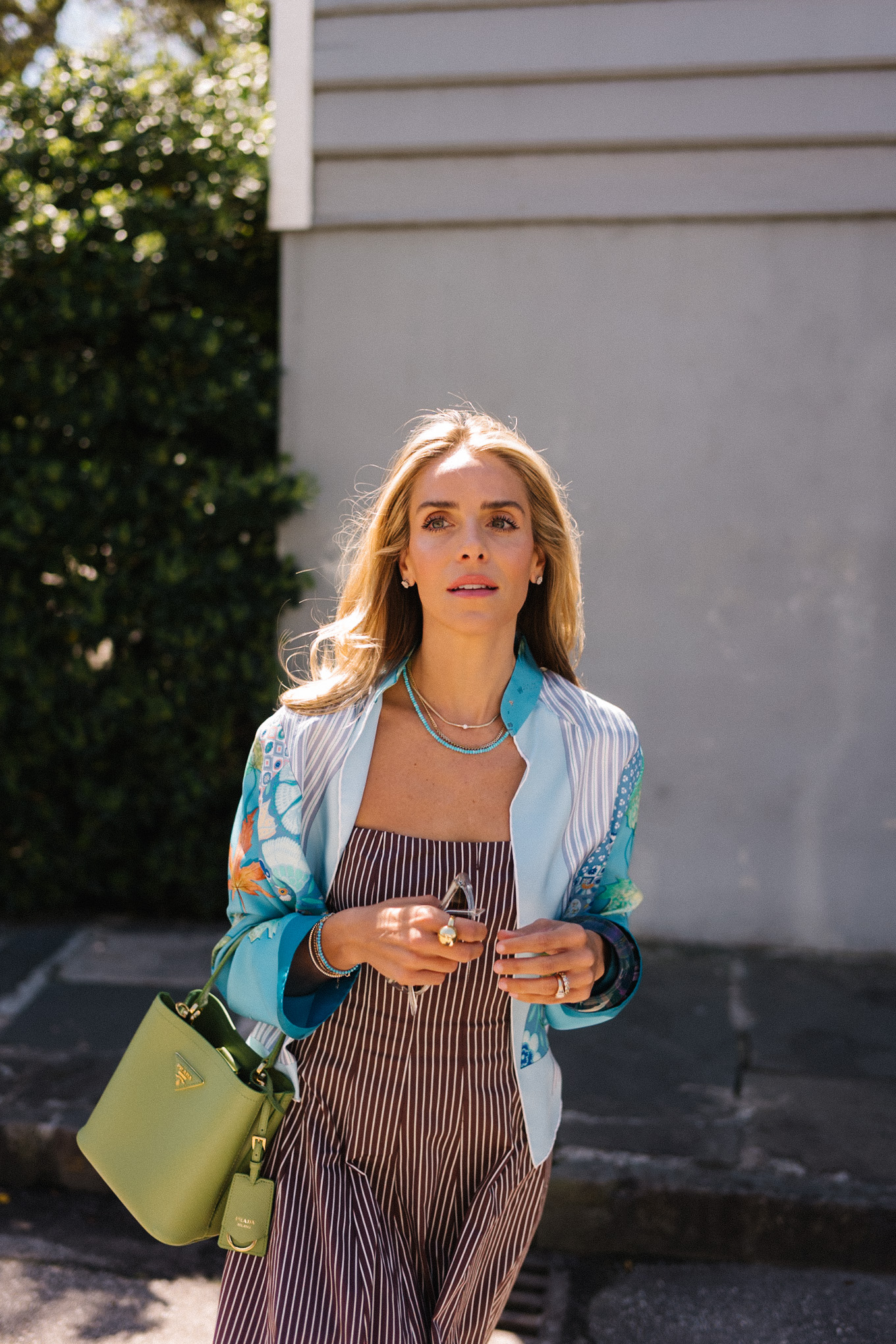 brown striped midi dress blue silk jacket green handbag woven flats