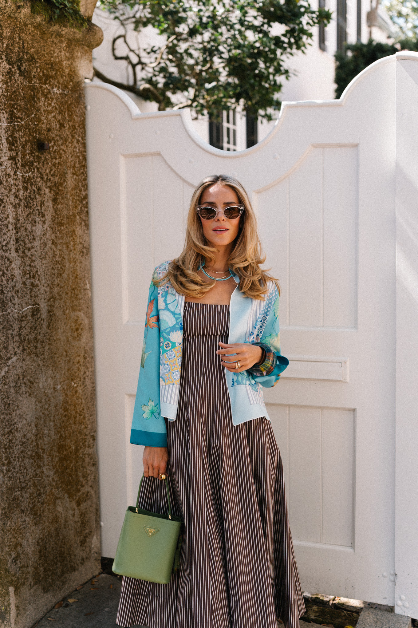 brown striped midi dress blue silk jacket green handbag woven flats