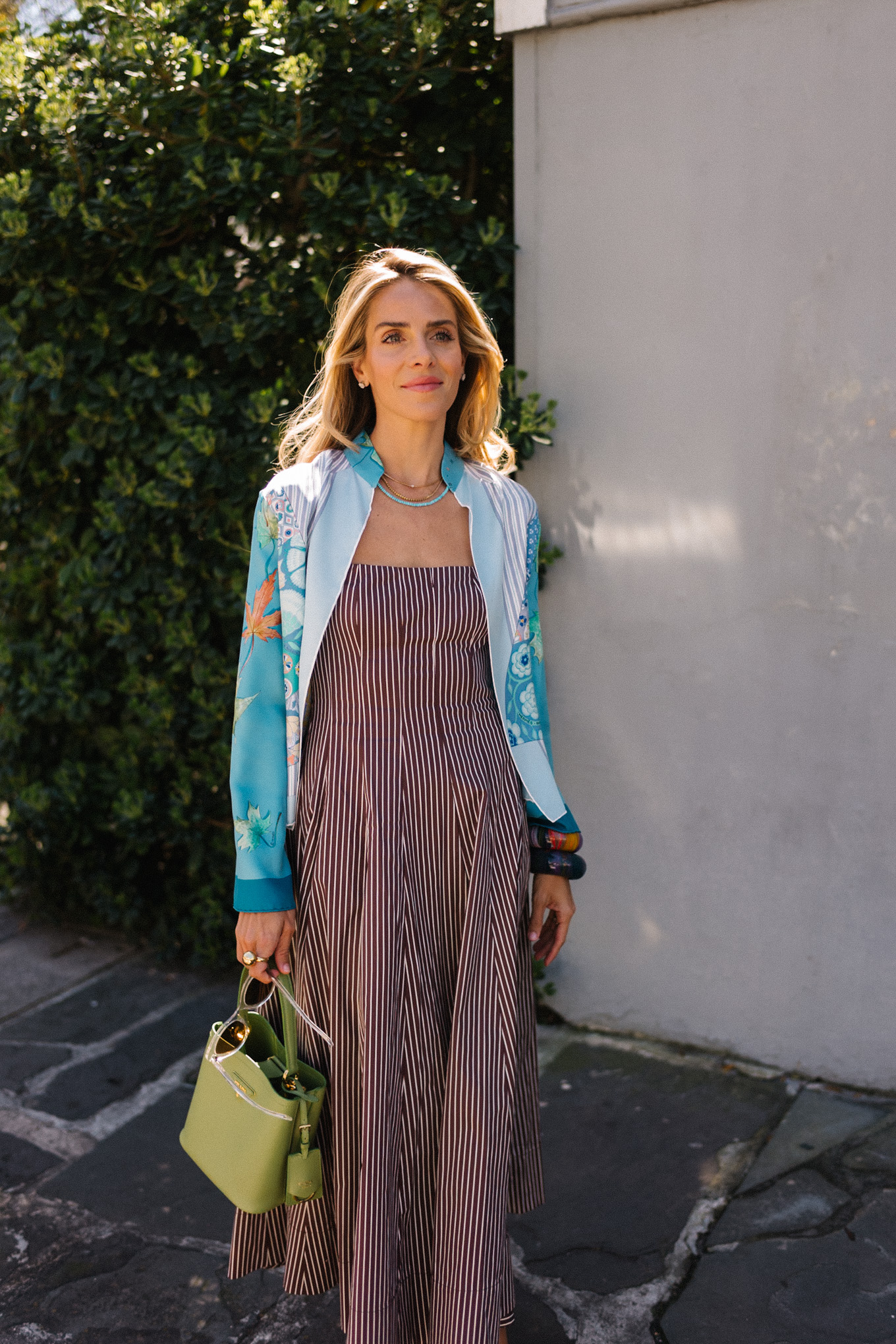 brown striped midi dress blue silk jacket green handbag woven flats