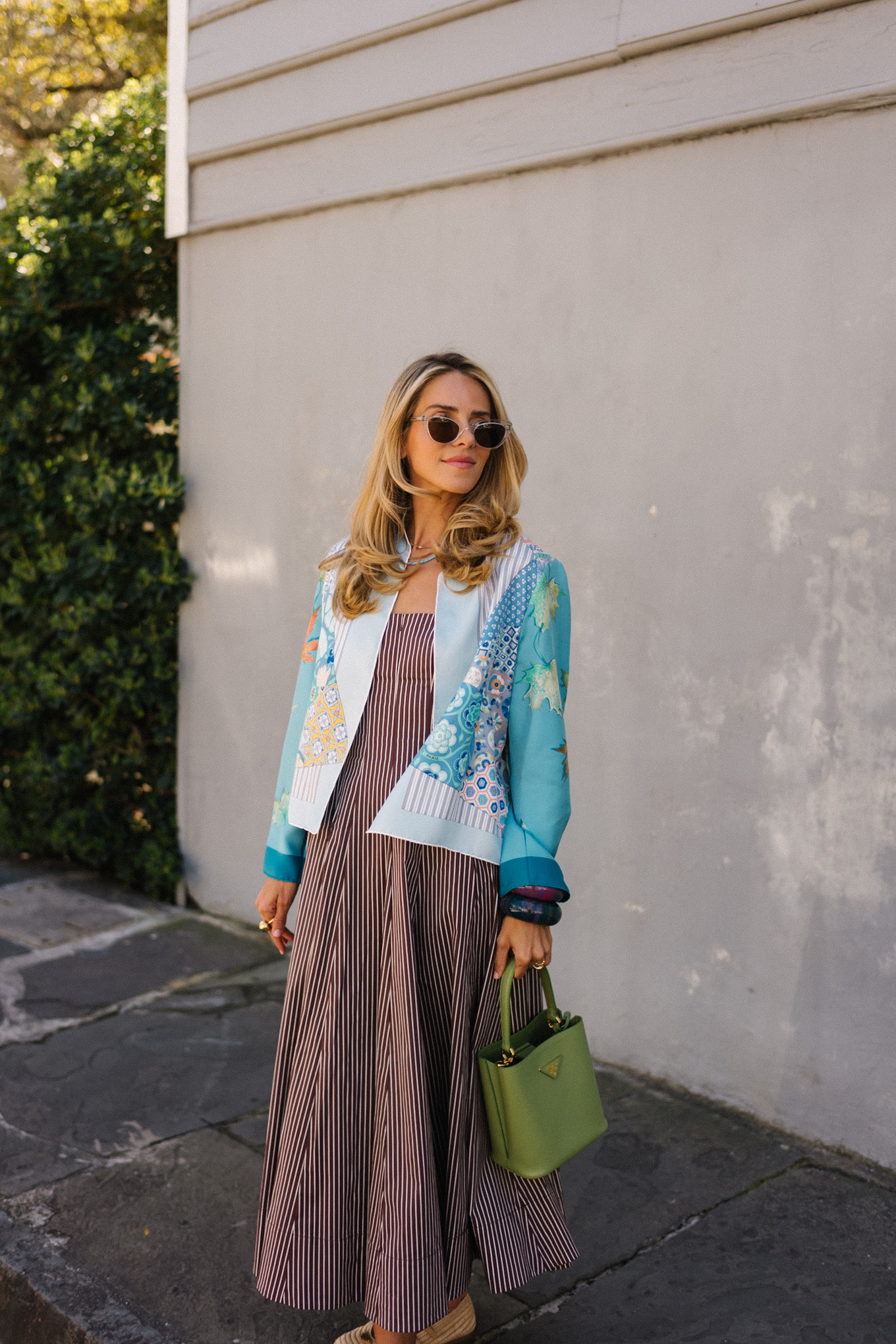 brown striped midi dress blue silk jacket green handbag woven flats