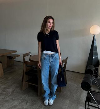 woman wearing white sneakers with spring denim outfit