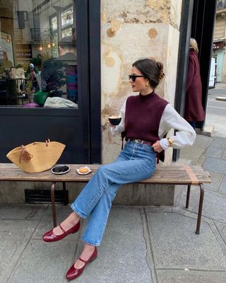 French influencer @leasy_inparis wearing jeans with red patent-leather flats.